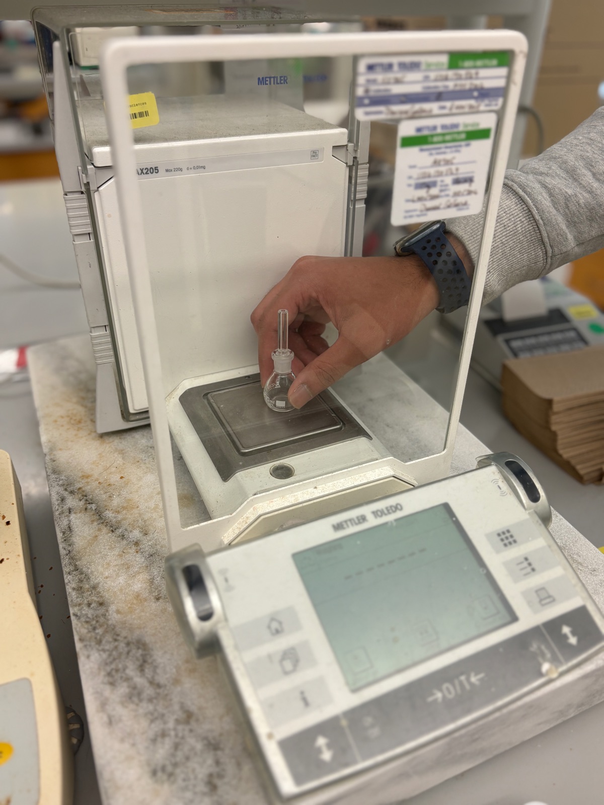 Laboratory balance used for physical property measurements